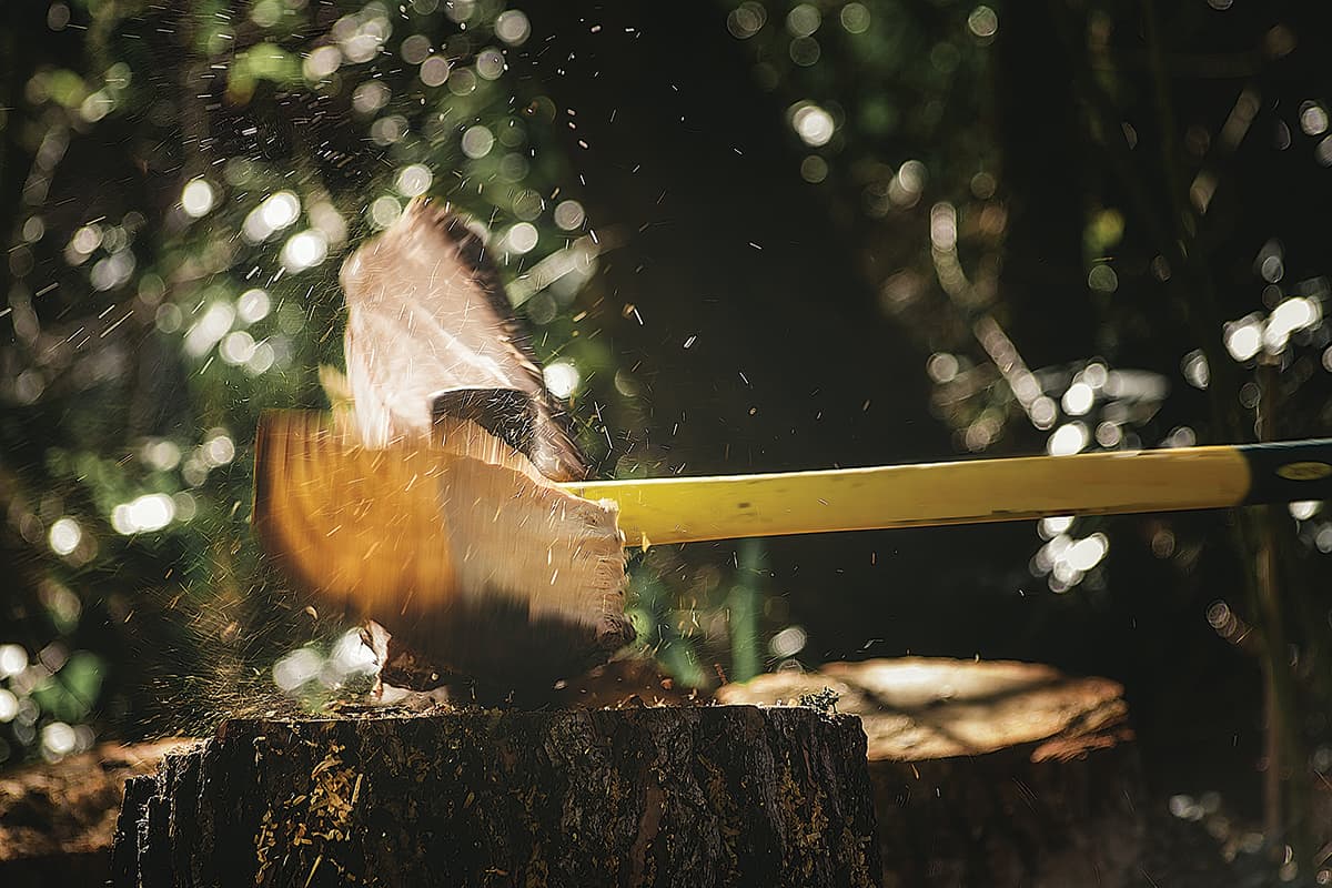 Action shot of wood being split with an axe